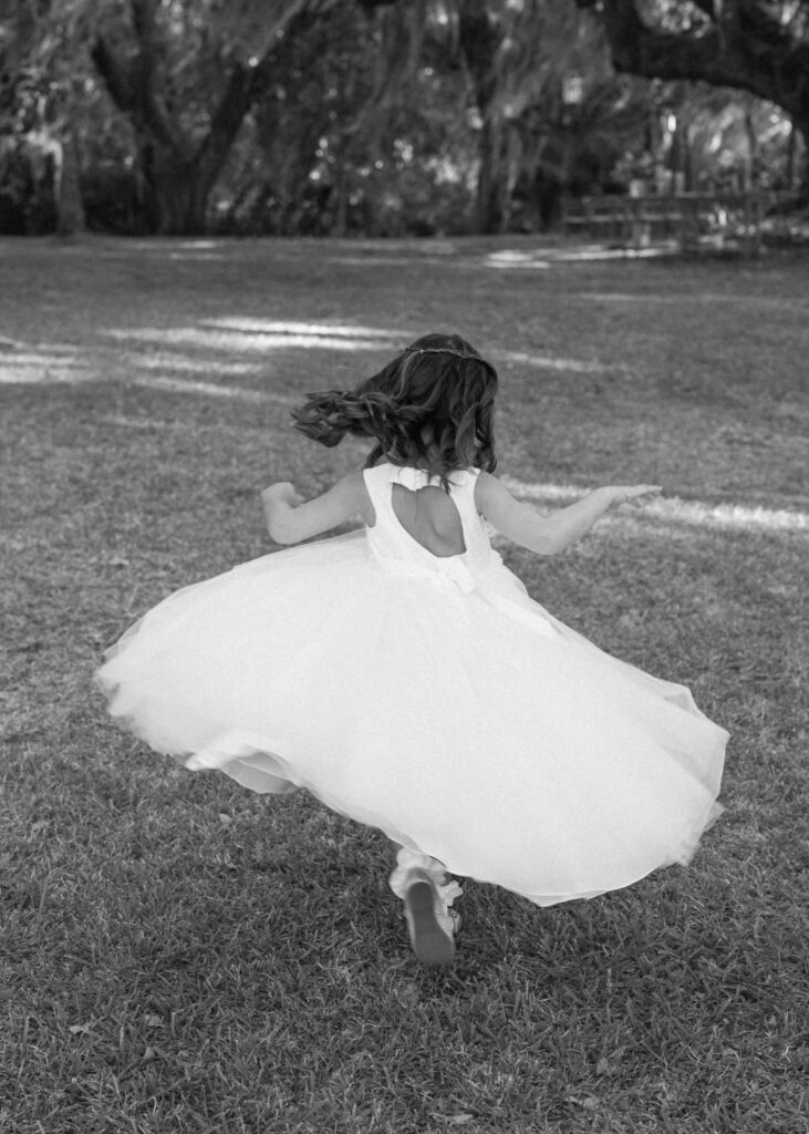 black and white of flower girl spinning