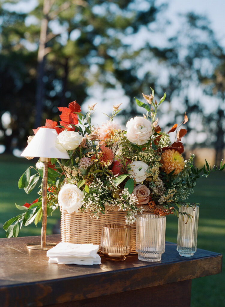 flowers on bar with lamp and candles