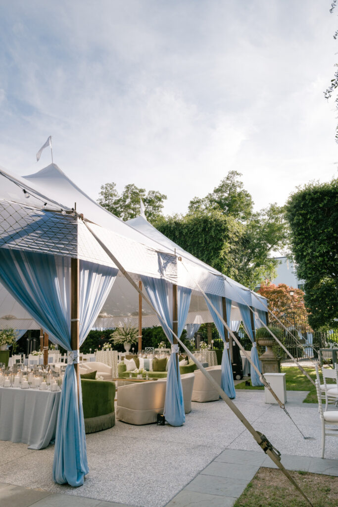 Tented wedding reception at the Gibbes Museum of Art with Blue Draping and soft seating.