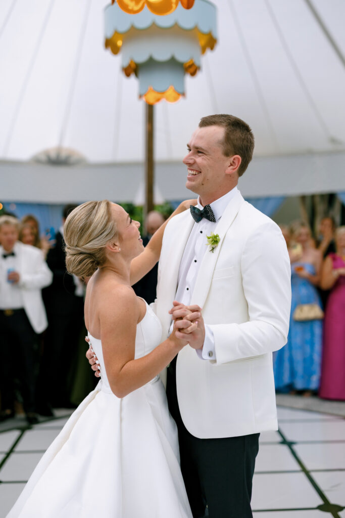 Bride and groom sharing their first dance at their tented wedding reception at The Gibbes Museum of Art in Charleston.