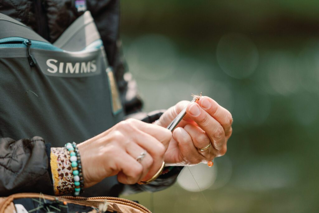 fisherman tying flys