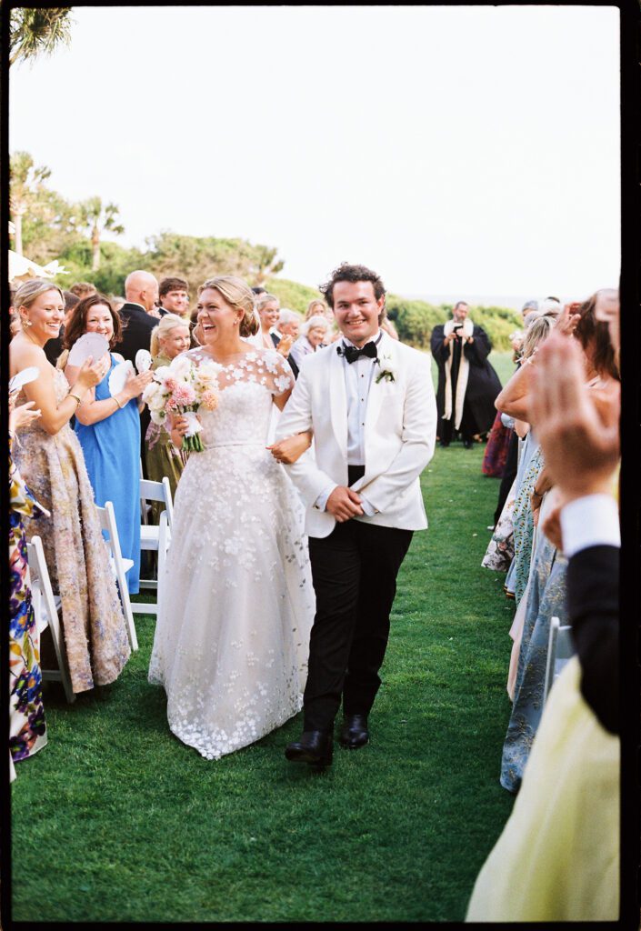 Bride and groom recessional at their kiawah island wedding ceremony 