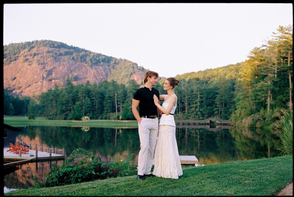 Bride and Groom to be in front of lake at High Hampton in Cashiers NC